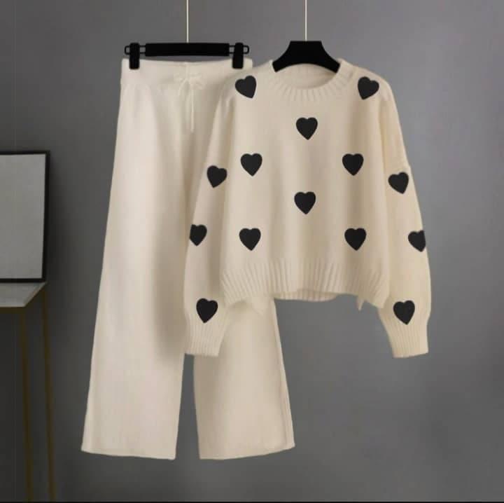 cream tracksuit with (black hearts)