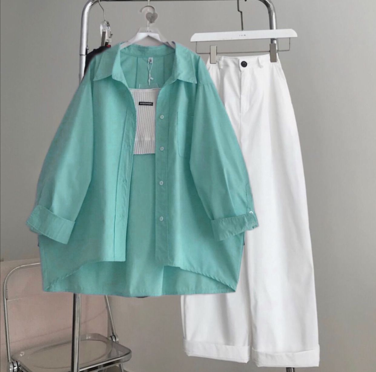 sea-green button down shirt with white wideleg jeans